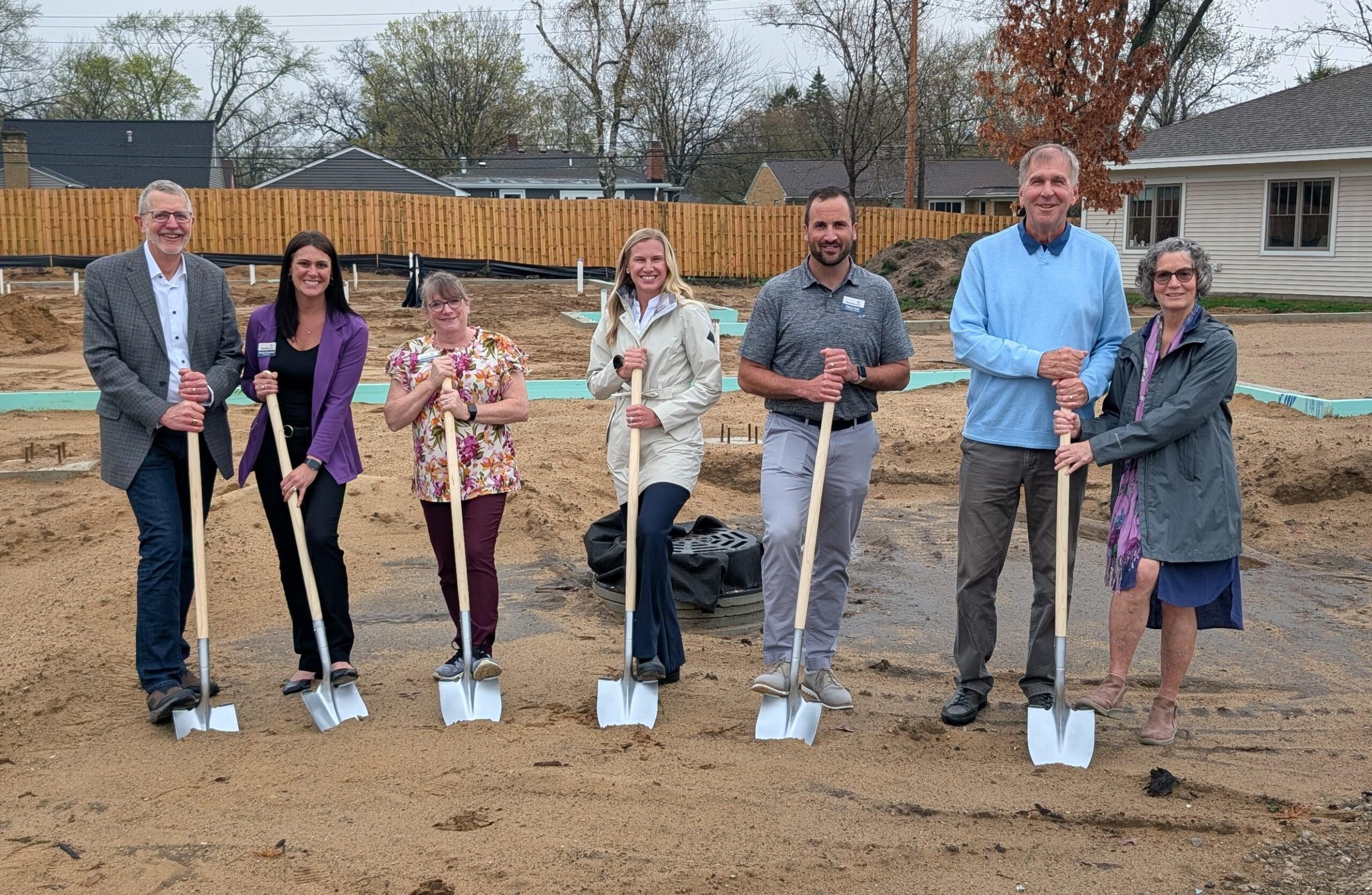 Resthaven leadership and campaign co-chairs hold shovels at the groundbreaking ceremony for the Maple Woods Cottage expansion in Holland, Michigan.